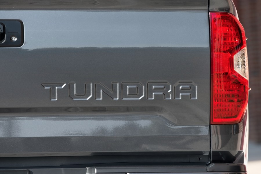 A close up of the toyota tundra logo on the side.