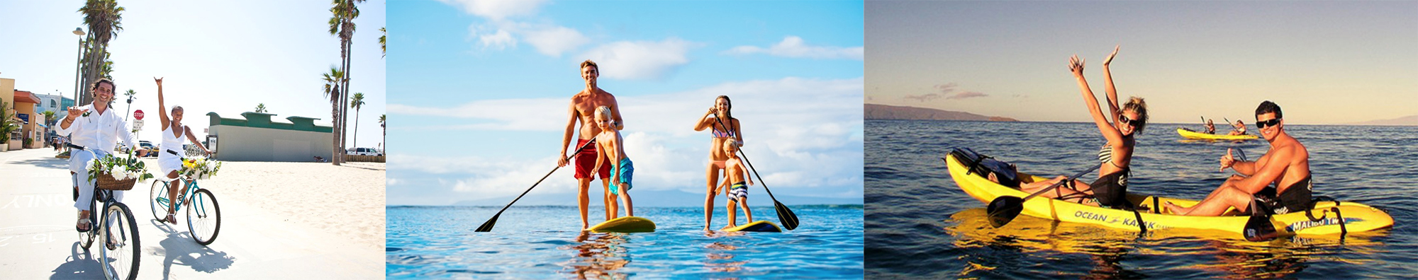 A family of four stand on surf boards in the ocean.